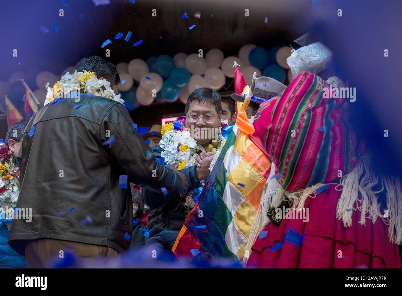 08 February 2020, Bolivia, El Alto: The presidential candidate Luis Arce of the party Movimiento al Socialismo (MAS) welcomes his supporters and shakes their hands. The new election on 3 May comes more than six months after the presidential election in October, which was overshadowed by accusations of manipulation and from which Morales emerged as the winner. Photo: Ivan Perez/dpa Stock Photo