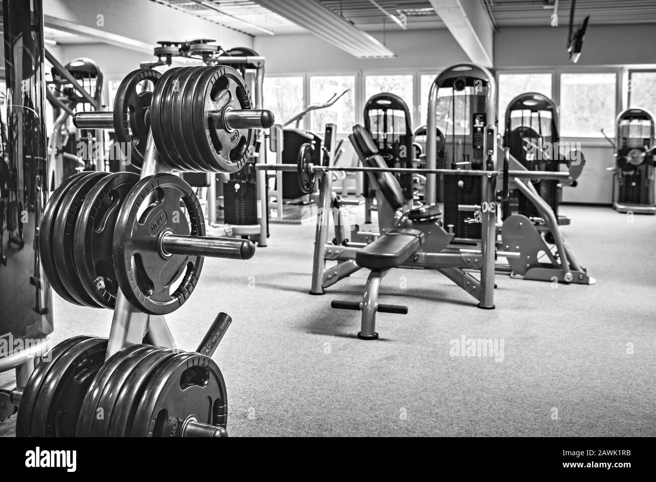 diverse equipment and machines at the gym room Stock Photo