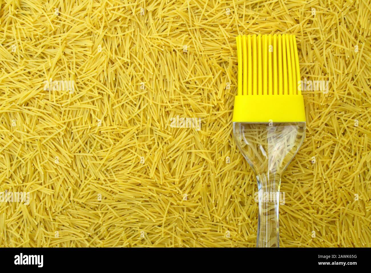 https://c8.alamy.com/comp/2AWK65G/background-with-italian-pasta-vermicelli-and-yellow-silicone-kitchen-brush-or-tassel-with-transparent-handle-copy-space-for-text-and-design-menus-or-2AWK65G.jpg