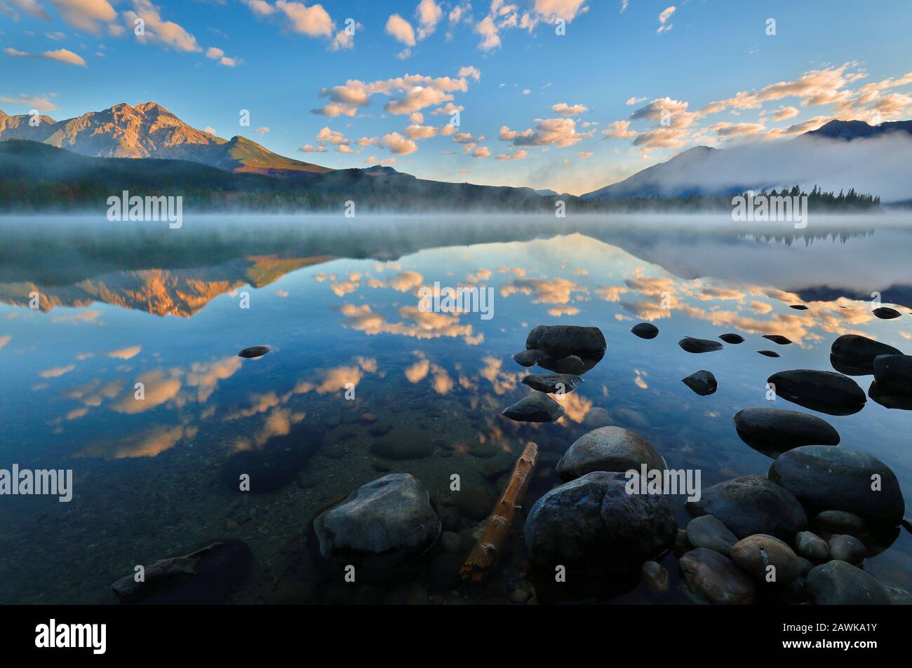 Beautiful sunrise over Edith Lake with fog, Jasper National Park ...