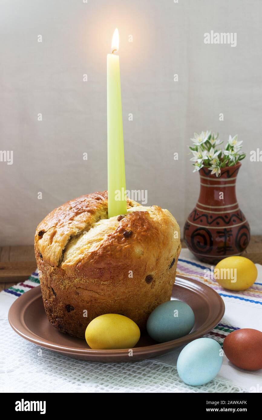 Traditional easter cake and colored eggs - easter still life. Rustic style. Stock Photo