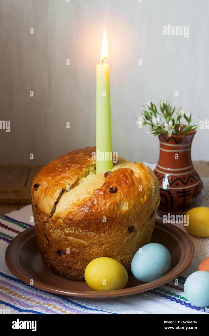 Traditional easter cake and colored eggs - easter still life. Rustic style. Stock Photo