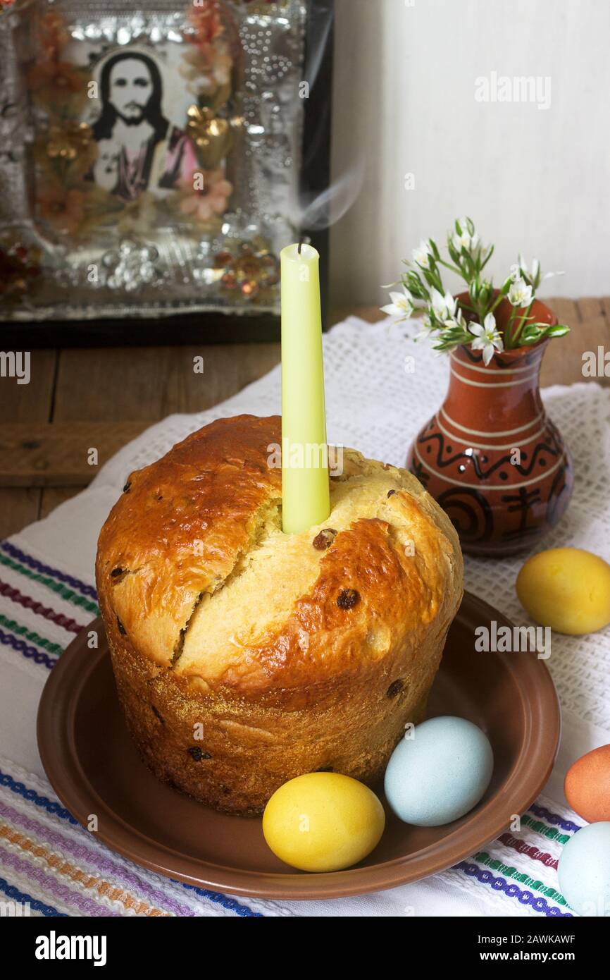 Traditional easter cake and colored eggs - easter still life. Rustic style. Stock Photo