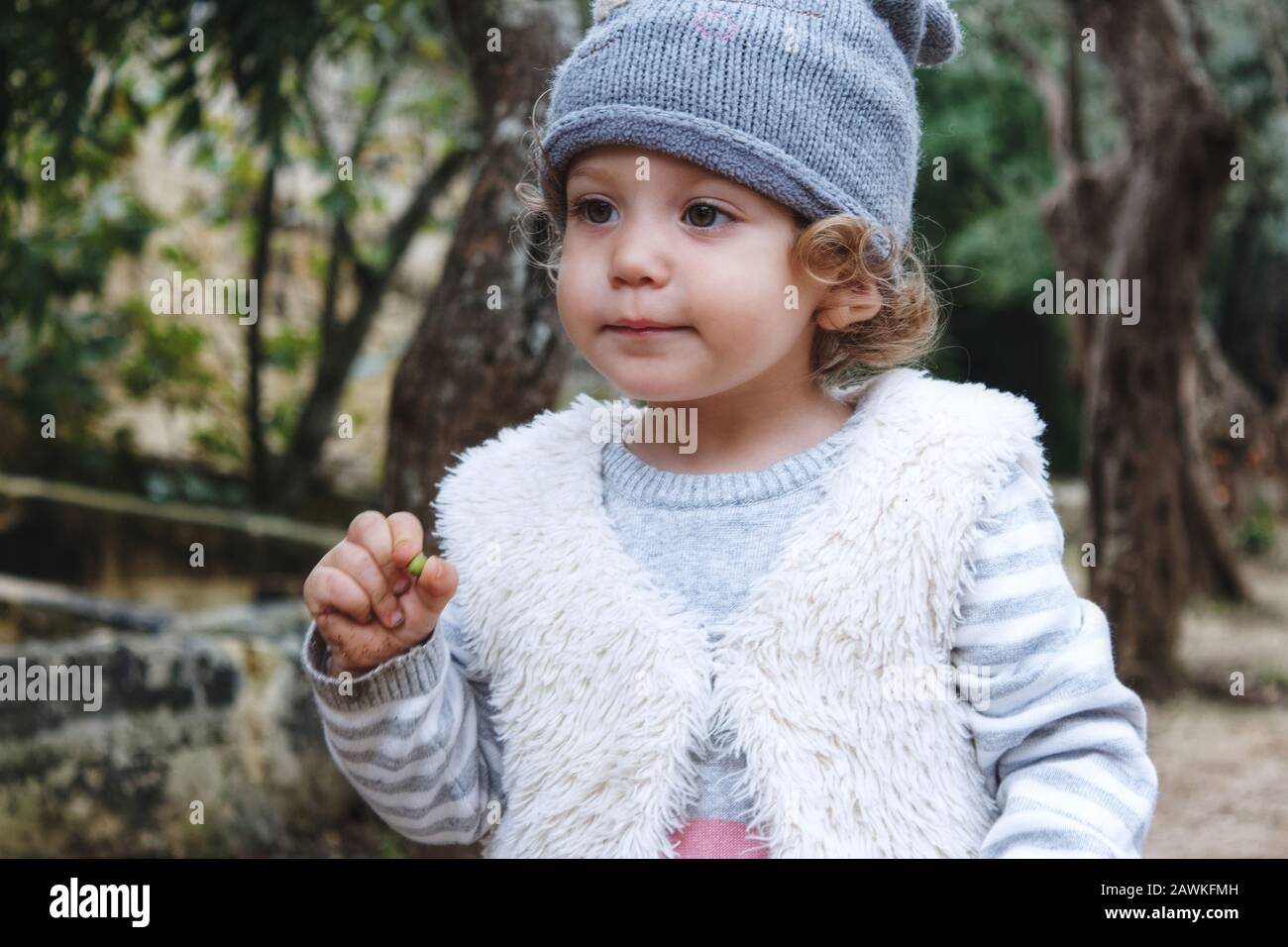 Beautiful young girl model wearing casual winter clothes outdoors in the forest Stock Photo