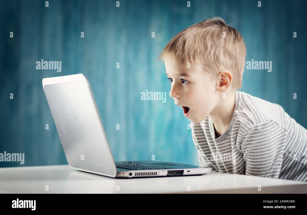 Computer addiction child boy laptop hi-res stock photography and images ...