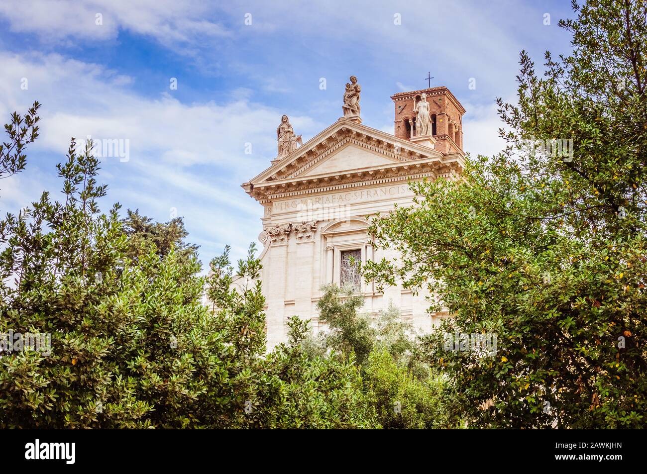 Ancient stone cathedral with blue sky with white clouds on the ...