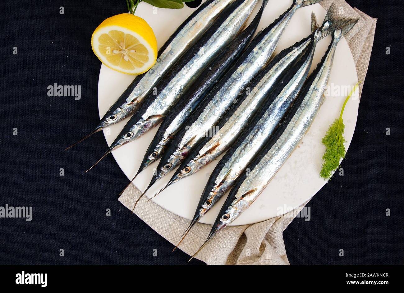 raw fresh needlefish (belonidae family) on the plate ready to cook Stock Photo