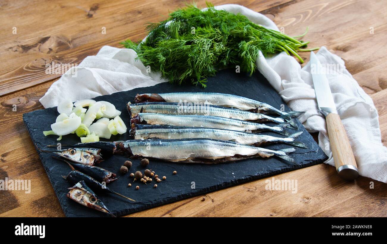 raw fresh needlefish (belonidae family) on the plate ready to cook Stock Photo