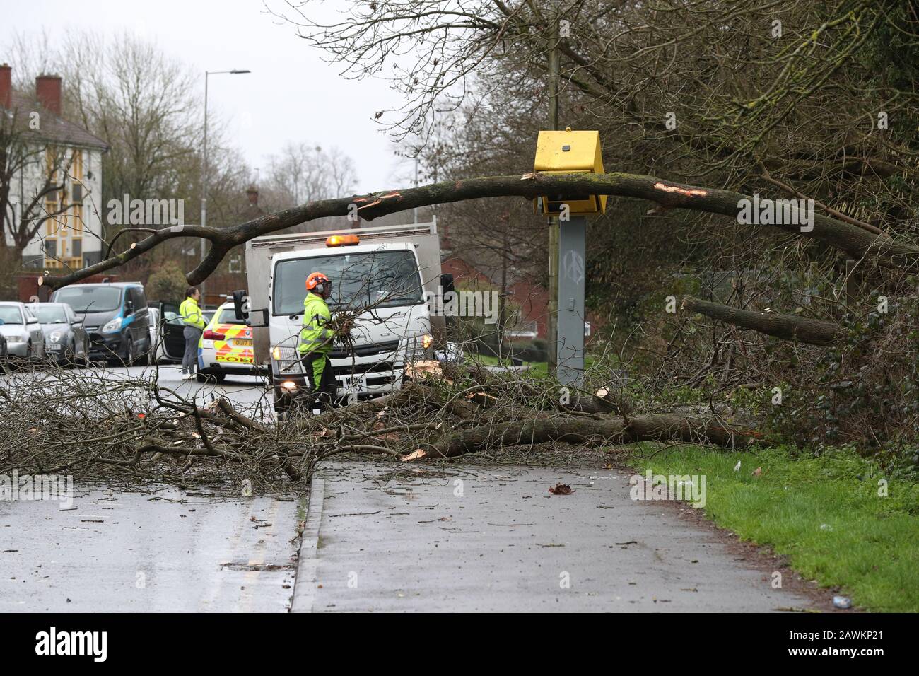 Workmen clear up after tree fell on speed camera and damaged it on The Meadway in Tilehurst, Reading as Storm Ciara hits the UK. PA Photo. Picture date: Sunday February 9, 2020. See PA story WEATHER Storm. Photo credit should read: Jonathan Brady/PA Wire Stock Photo
