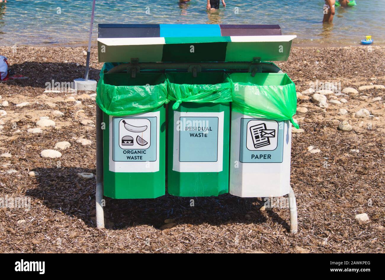 Recycling bins on a public natural beach Stock Photo Alamy
