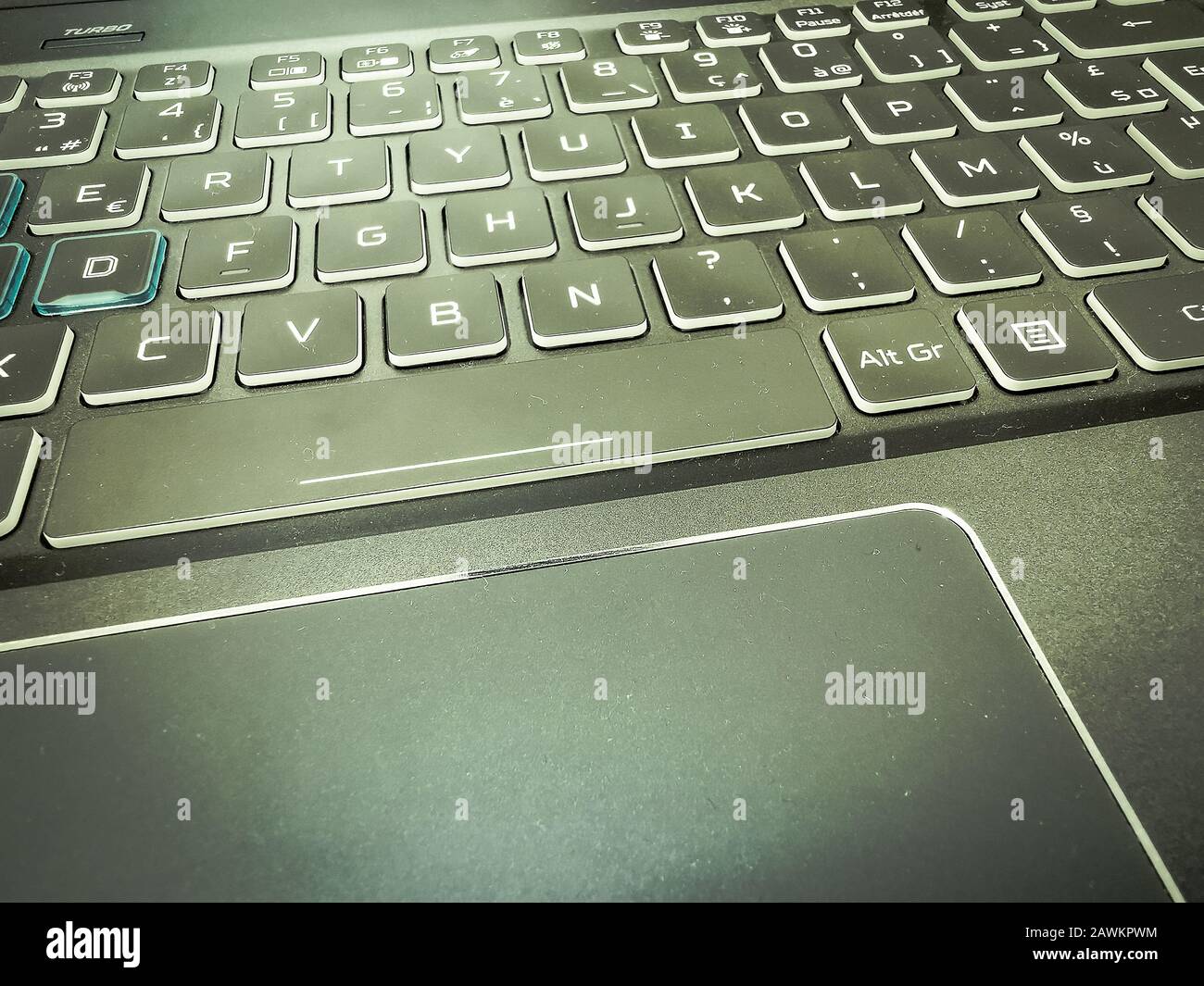 Modern laptop gaming keyboard with blue led backlight and touch pad Stock  Photo - Alamy