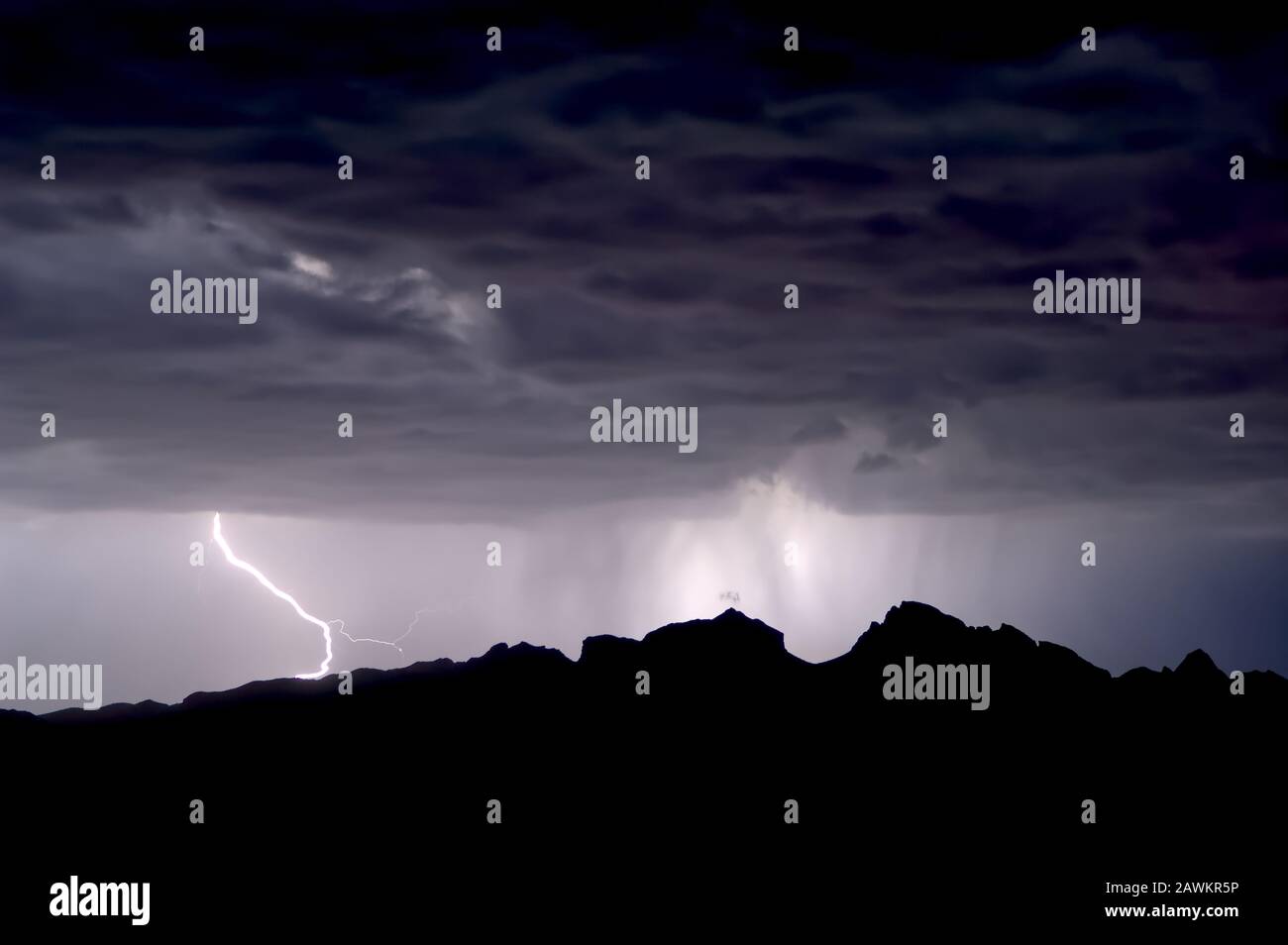 A monsoon storm brewing over Saddleback Mountain in western Arizona. Stock Photo