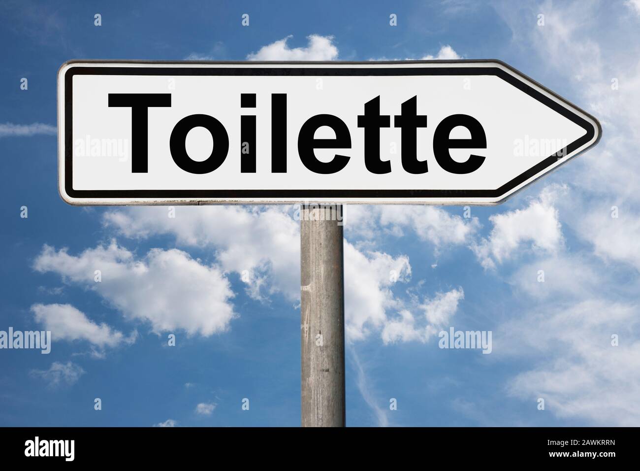 Detail photo of a signpost with the inscription Toilette (Toilet) Stock Photo