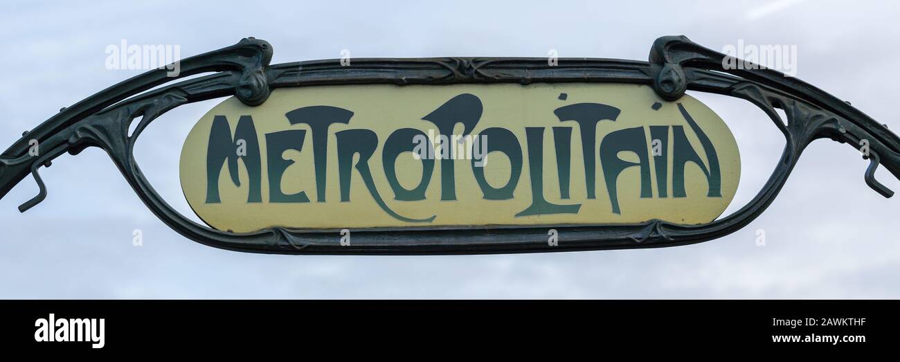 Close up of a Metropolitain sign, indicating the entrance to a subway station. The parisian metro system is famous for its unique style. Stock Photo