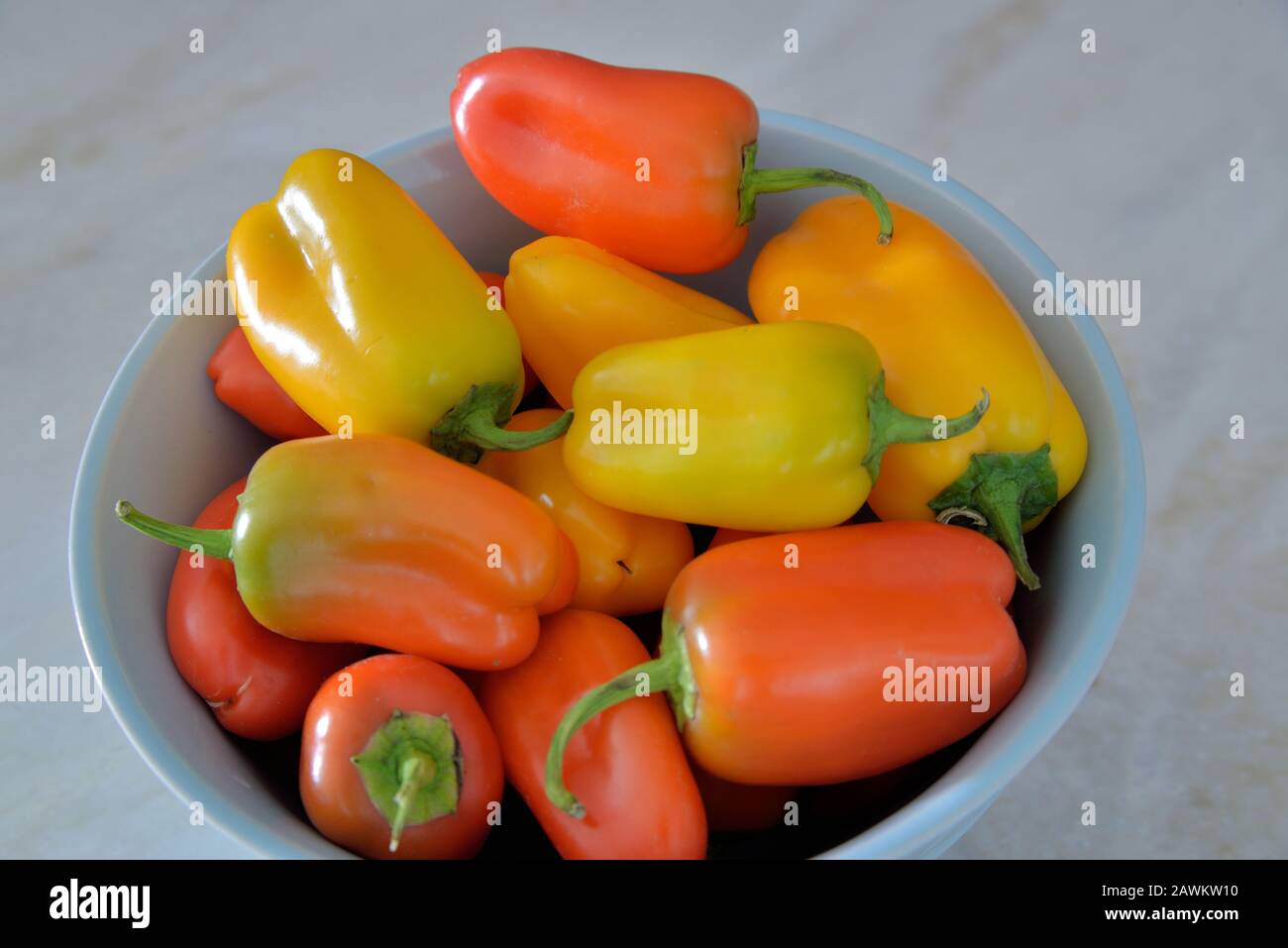 a bowl of colorful sweet peppers ready to add to a salad. Stock Photo