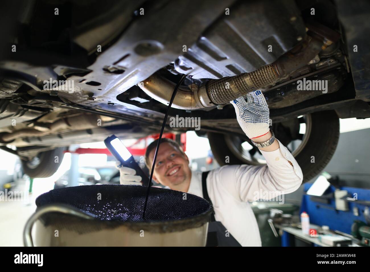 Mechanic conducts thorough inspection car garage. Stock Photo
