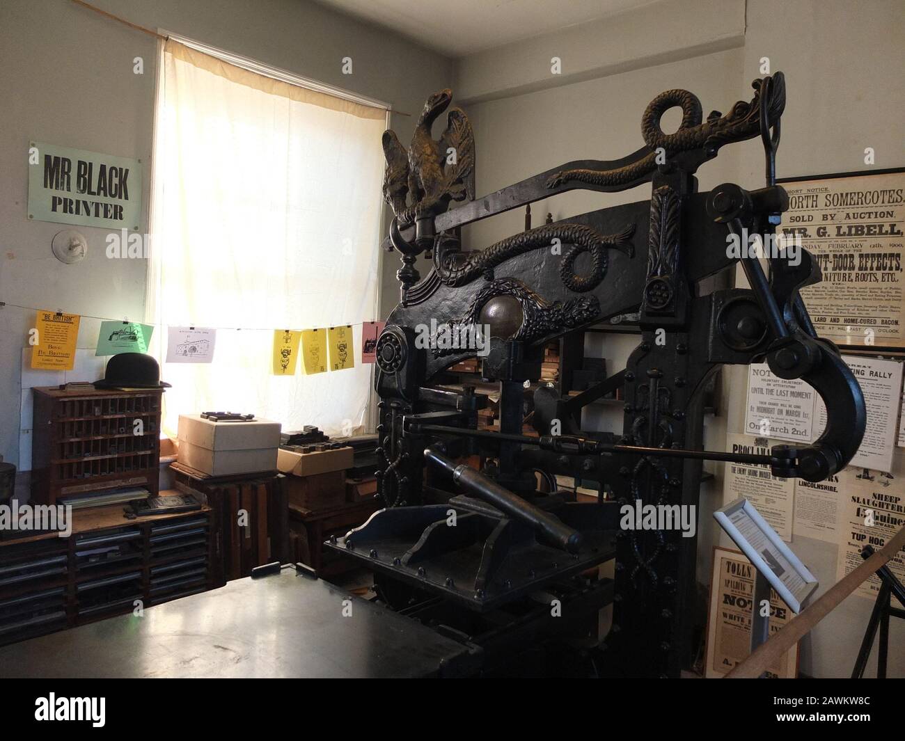 Recreated vintage printers shop display with a large ornate printing
