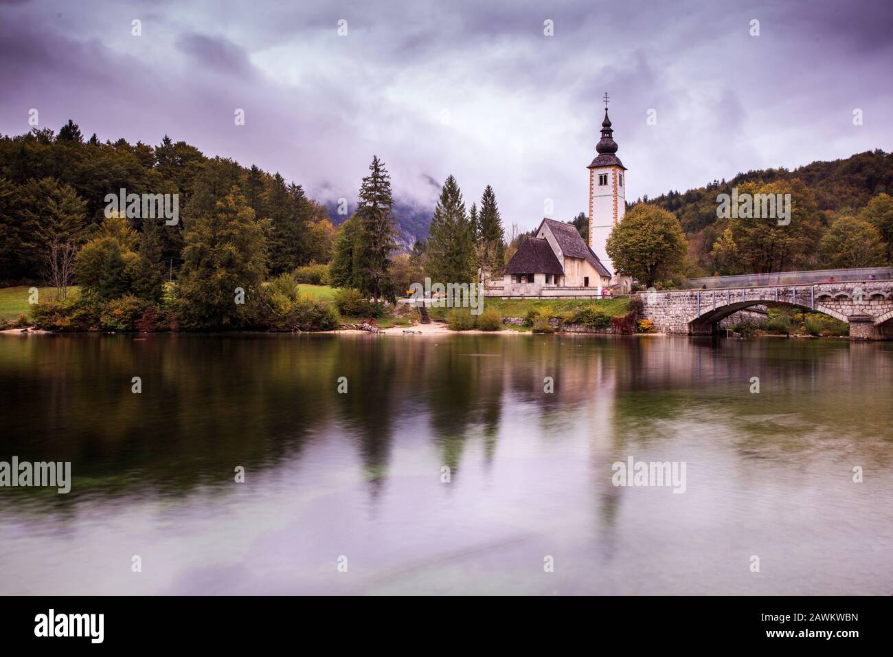 St John the Baptist church reflected on the Bohinj lake, Slovenia Stock ...