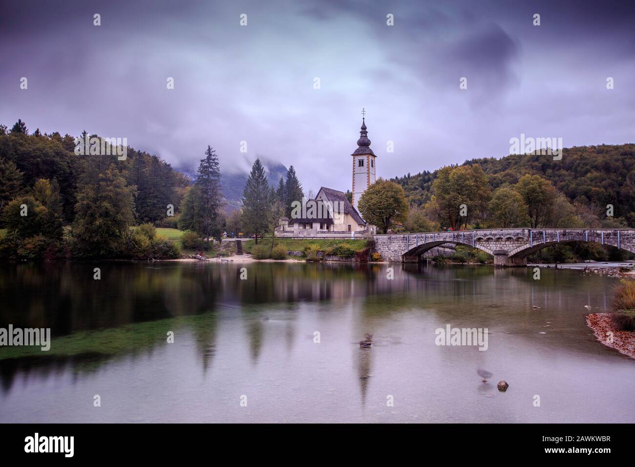 St John the Baptist church reflected on the Bohinj lake, Slovenia Stock ...