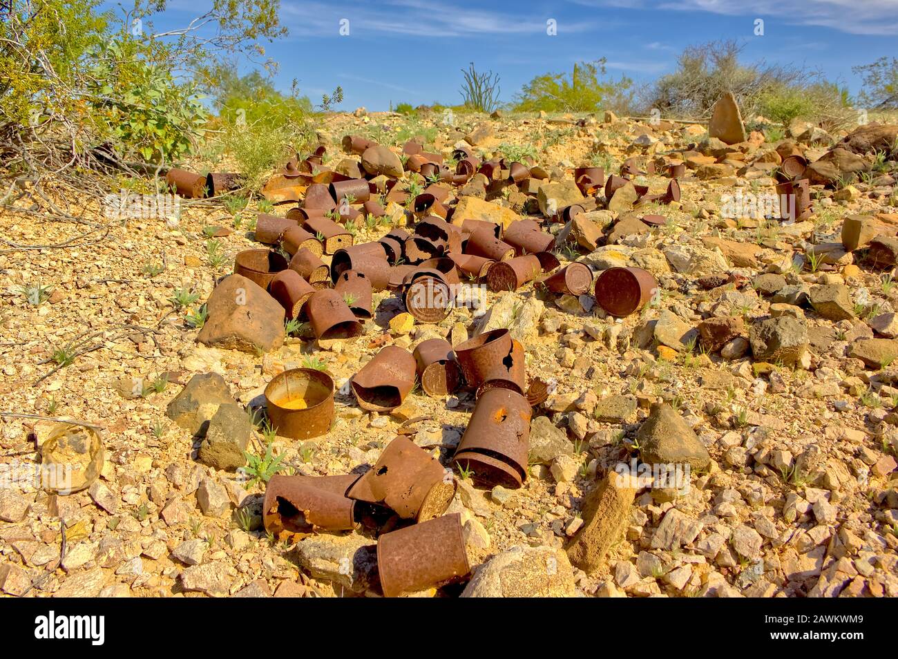 A pile of old rusty metal cans in the ghost town of Sundad Arizona. Sundad began in the 1920s as a TB Sanitarium, but when a viable treatment was foun Stock Photo