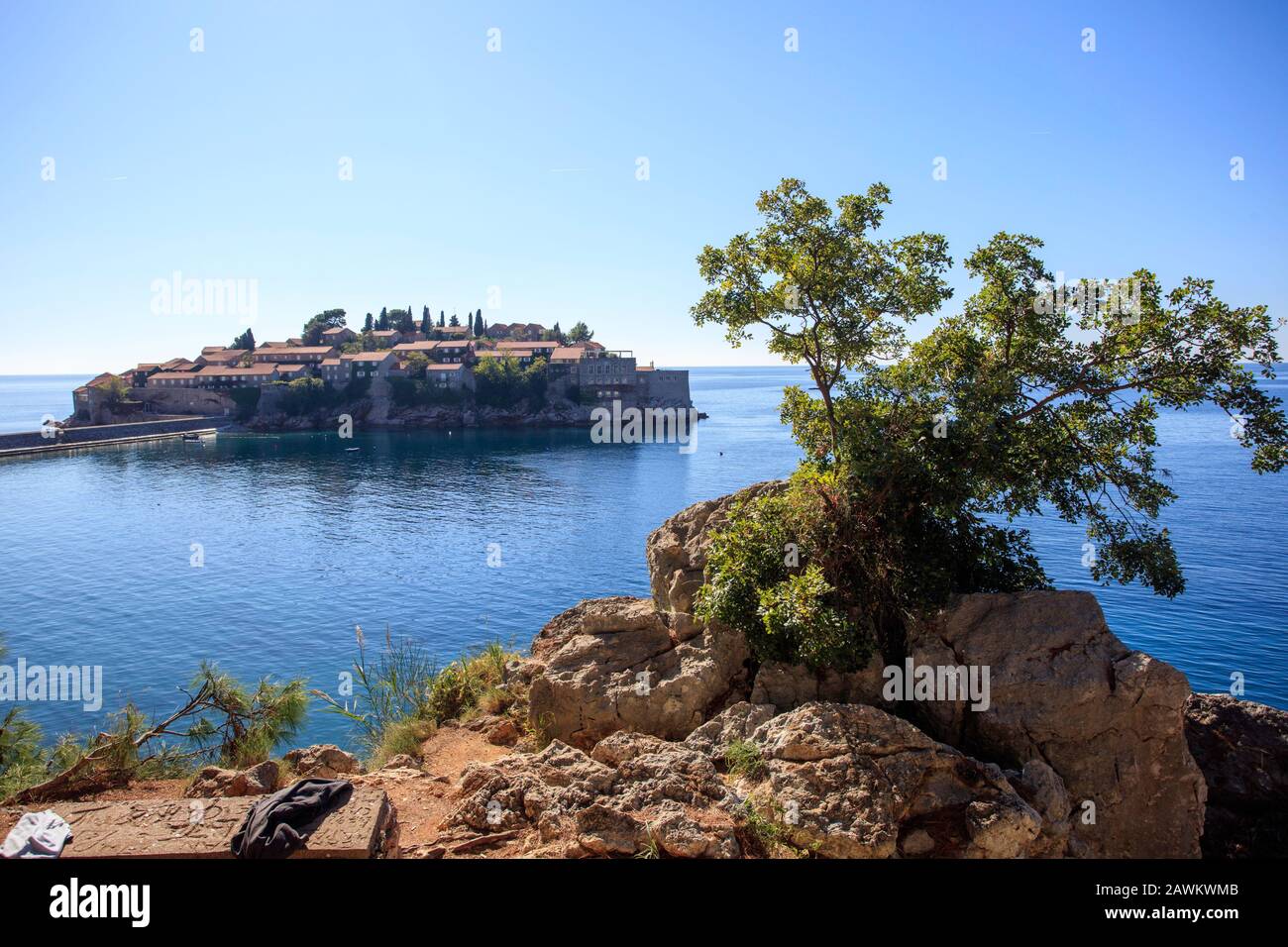 Sveti Stefan is a private island run by Aman Resorts providing luxury accommodation. It stands on the Adriatic coast south of Budva, Montenegro. Stock Photo