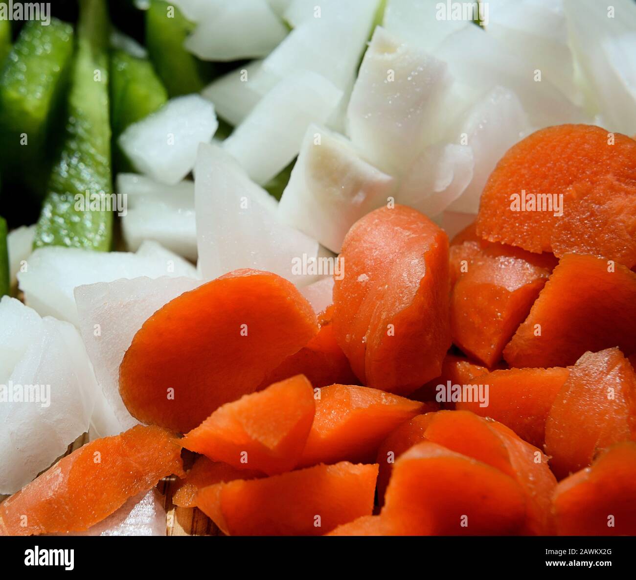 Chopped carrots, green pepper and onions. Stock Photo