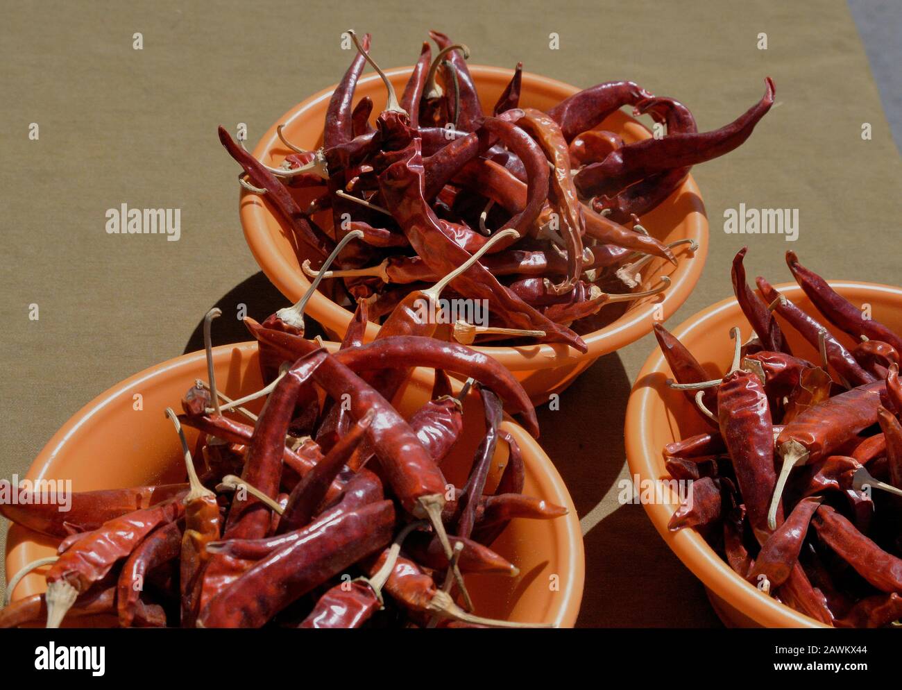 Hot peppers on display at a farmers market. Stock Photo