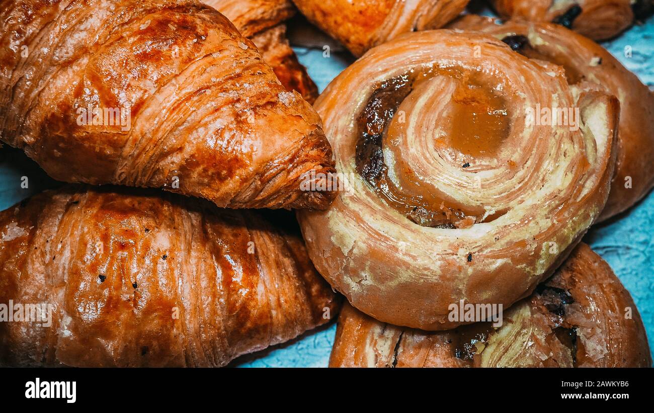 Classic french butter croissant and raisin swirl, pain aux raisins from