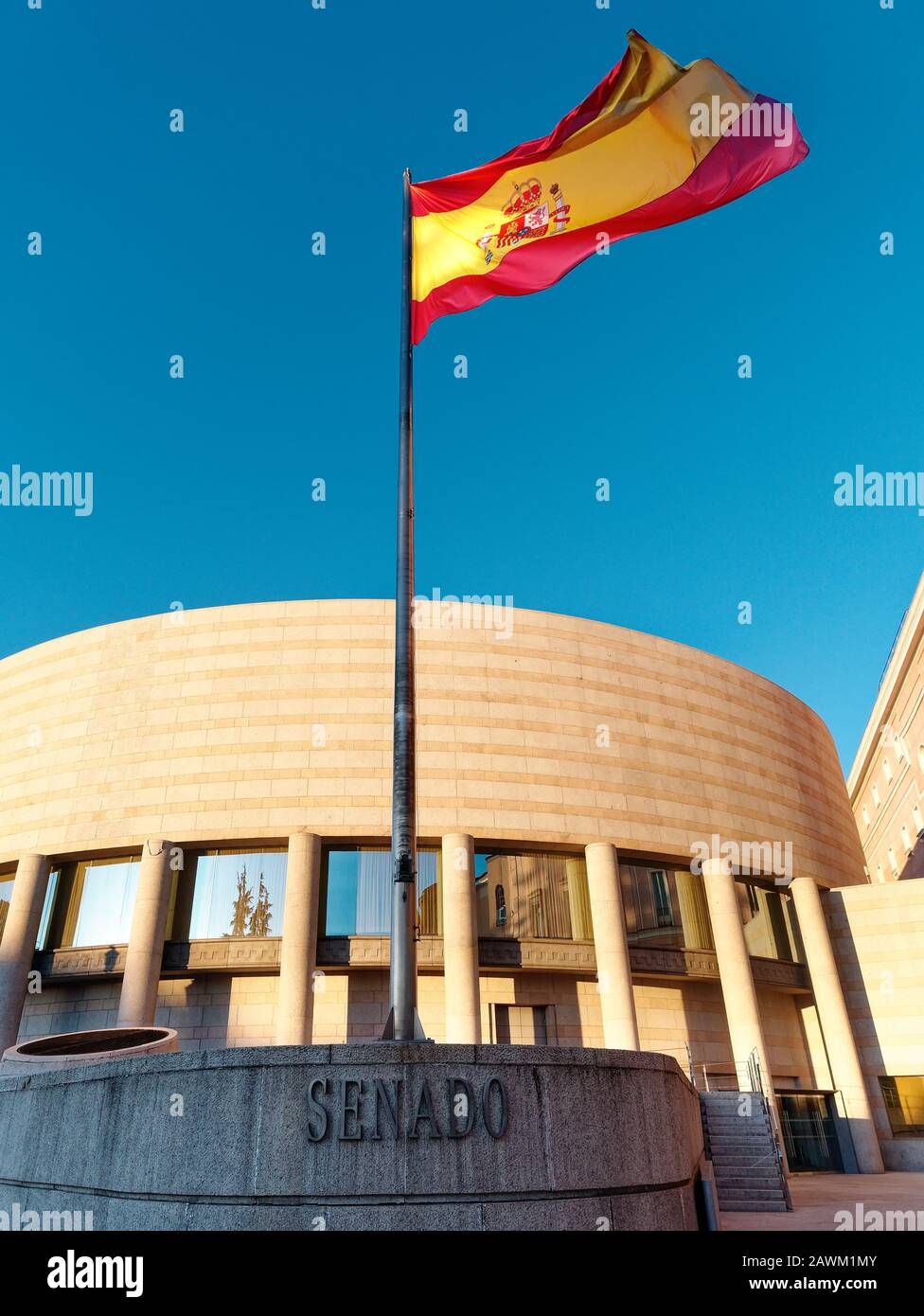 Exterior view building of Spanish senate (senado) with national flying ...