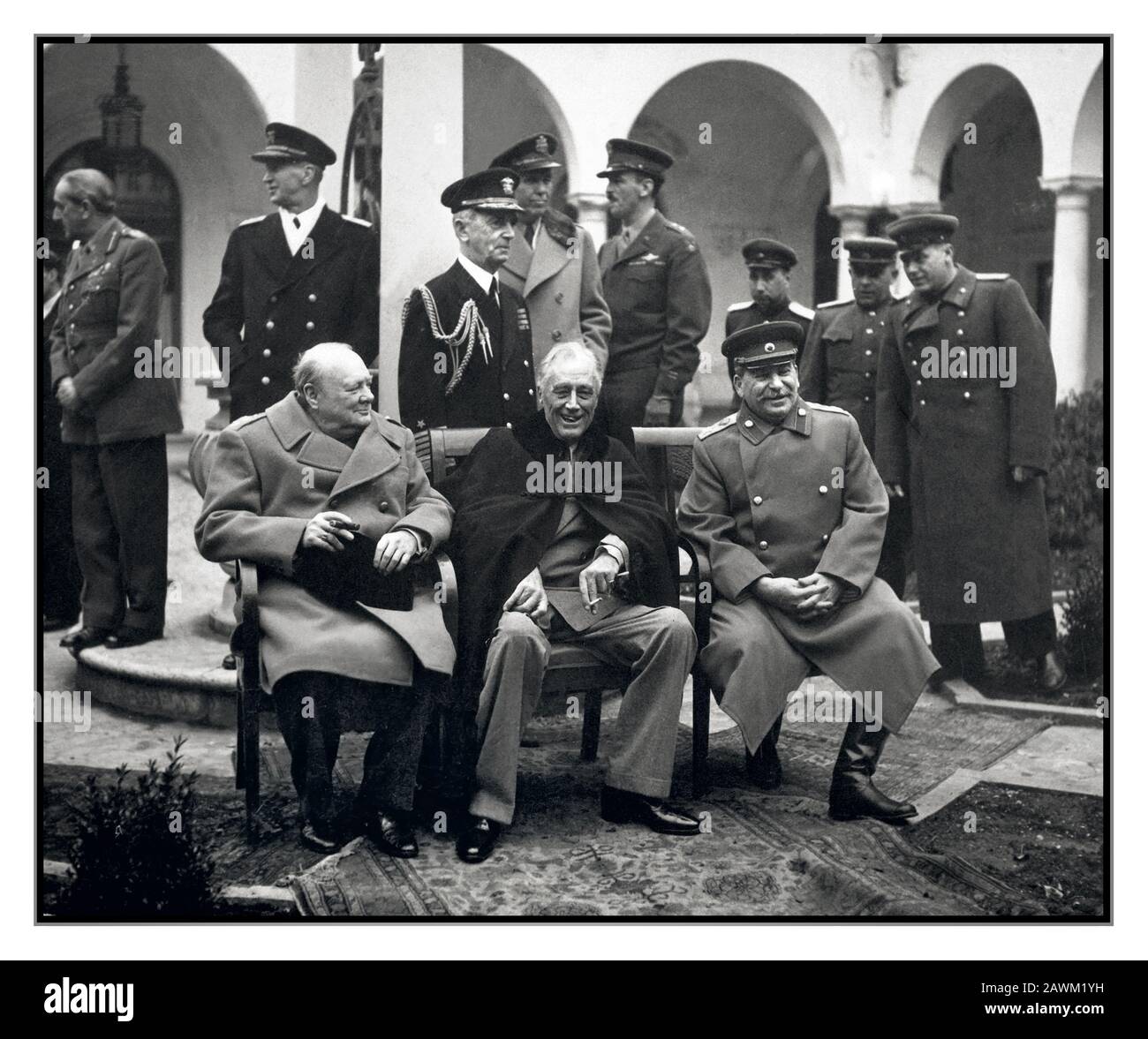 YALTA 1945 World War II Conference of the ‘Big Three’ at Yalta make final plans for the defeat of Germany.  Here the 'Big Three' happily sit on the patio together, Prime Minister Winston S. Churchill, President Franklin D. Roosevelt, and Premier Josef Stalin. February 1945. Stock Photo