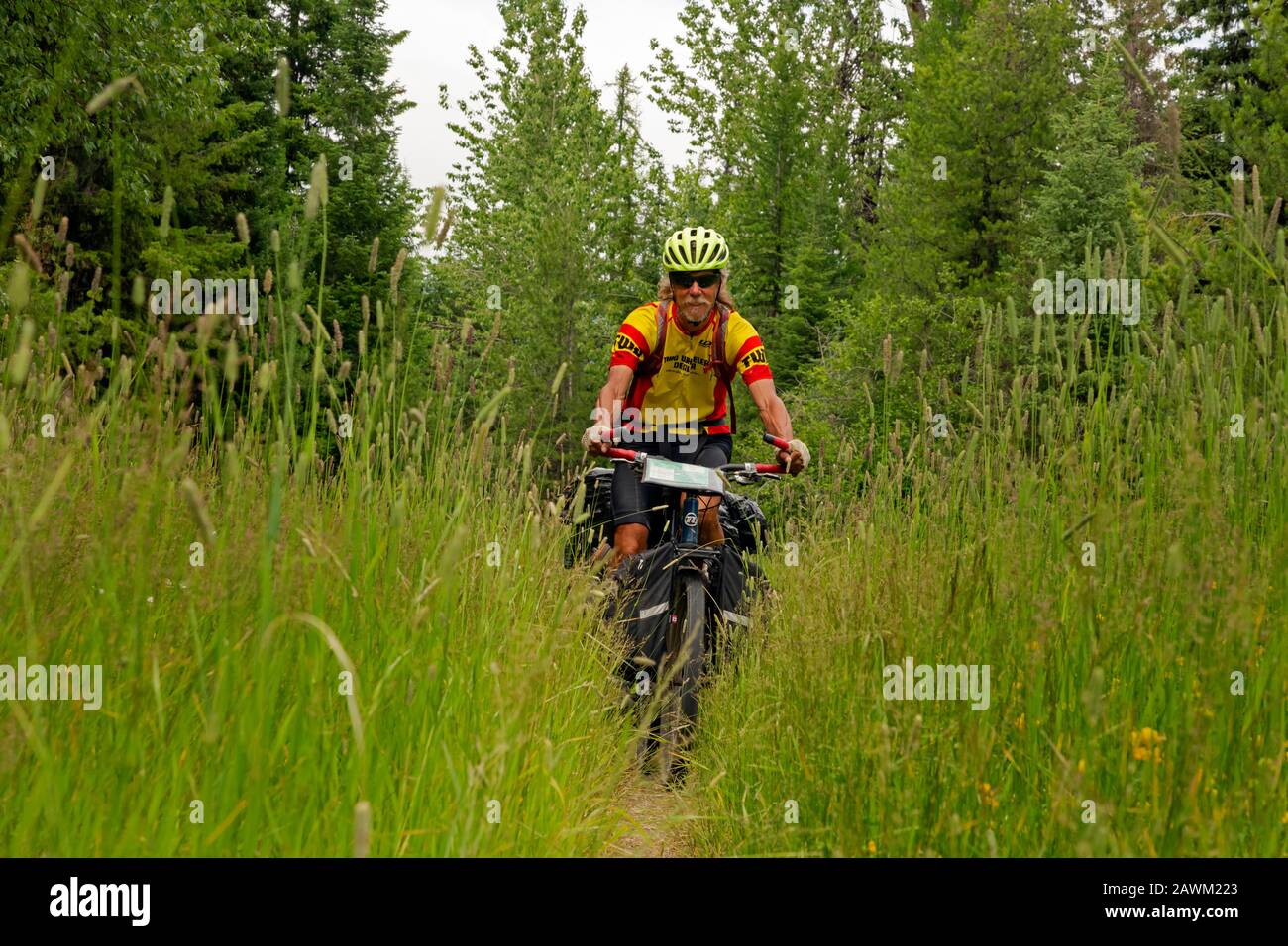 MT0046600...MONTANA Tom Kirkendall riding the narrow trail created
