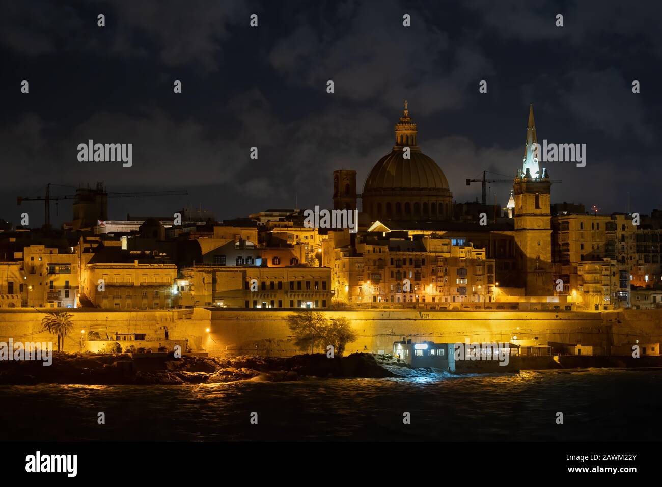City of Valletta in Malta by night, walled capital of an island nation in the Mediterranean Sea. Stock Photo