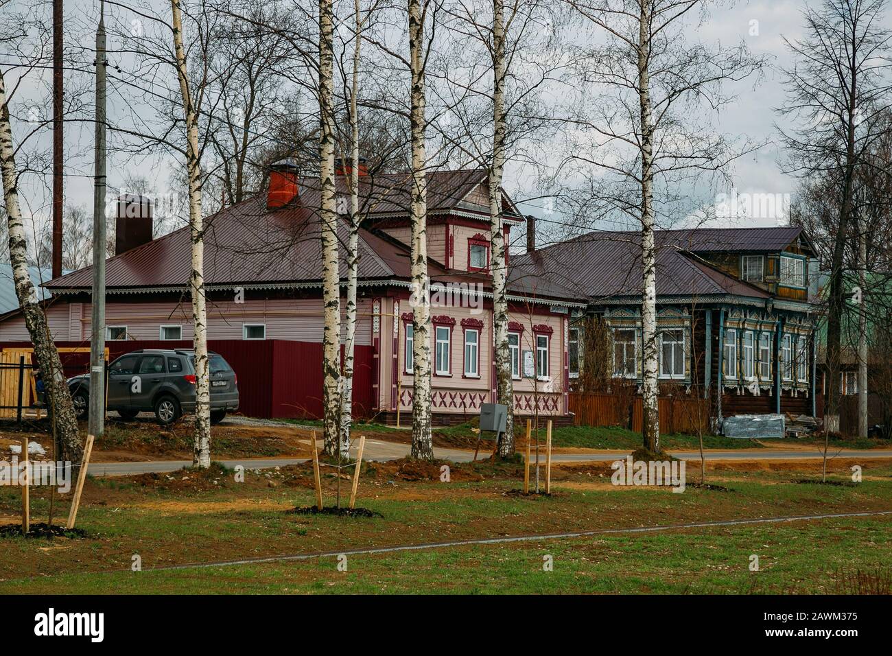 Old Russian village. Wooden houses with carved windows Stock Photo - Alamy