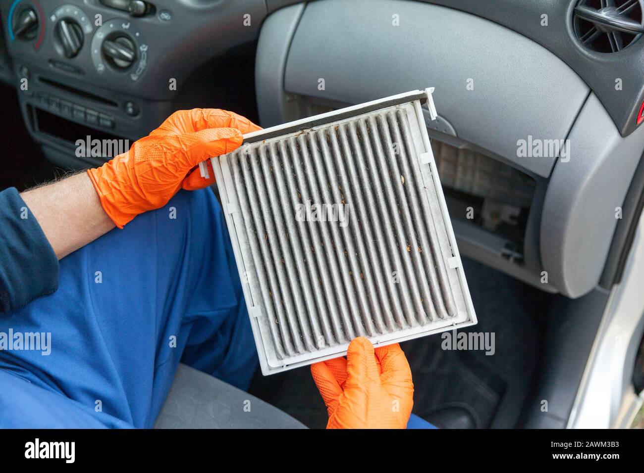 Replacing an old car cabin air filter Stock Photo Alamy