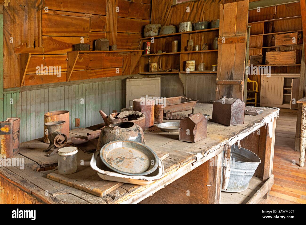 MT00501-00...MONTANA - Display of old kitchen pots and pans  in the food preparation rooms at the J.K. Wells Hotel, preserved at the ghost town of Gar Stock Photo