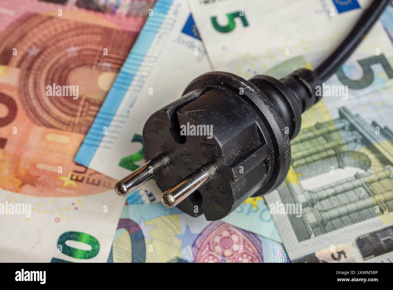 Power plug with Euro notes Stock Photo