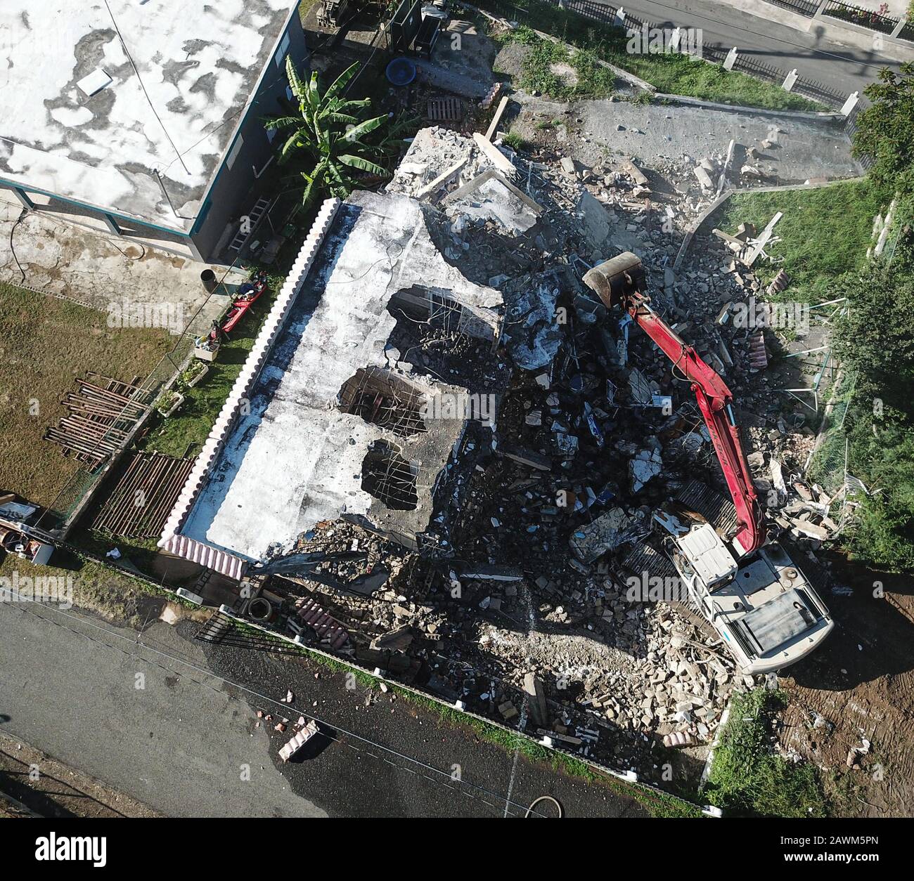Yauco, Puerto Rico. 8th Feb, 2020. First house demolished by an excavator due to earthquake in Almacigo Bajo Sector La Republica in Yauco, Puerto Rico. (Credit Image: © Marcus SantosZUMA Wire) Stock Photo