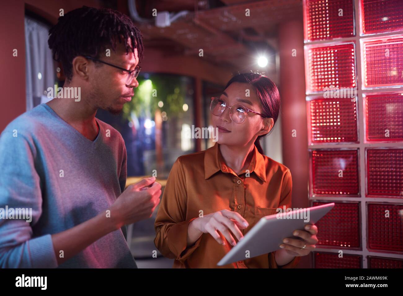 Waist up portrait of contemporary business team working on project in futuristic office interior, copy space Stock Photo