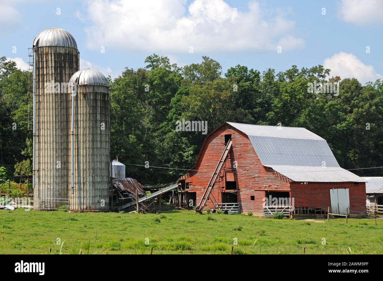 Old Red Barn and Grain Silos on a Working Farm in the Country
