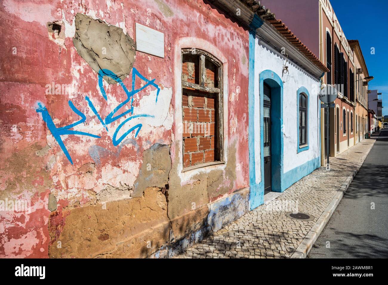 Graffiti on boarded up house, Silves, Algarce, Portugal Stock Photo