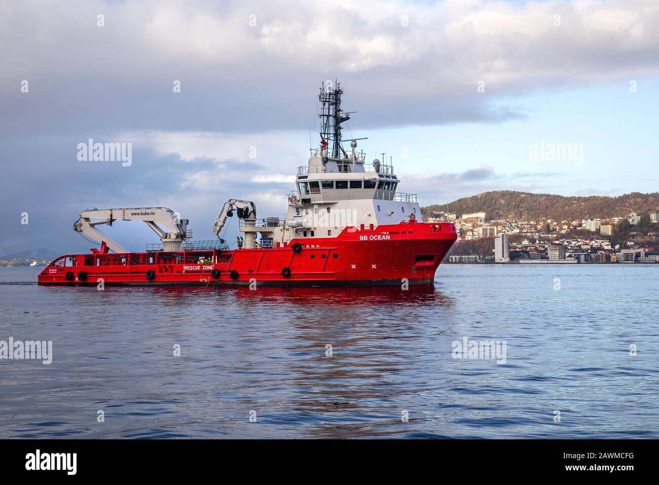 Offshore supply AHTS vessel BB Ocean at Byfjorden, arriving the port of Bergen, Norway. A rainy, dark winter day Stock Photo