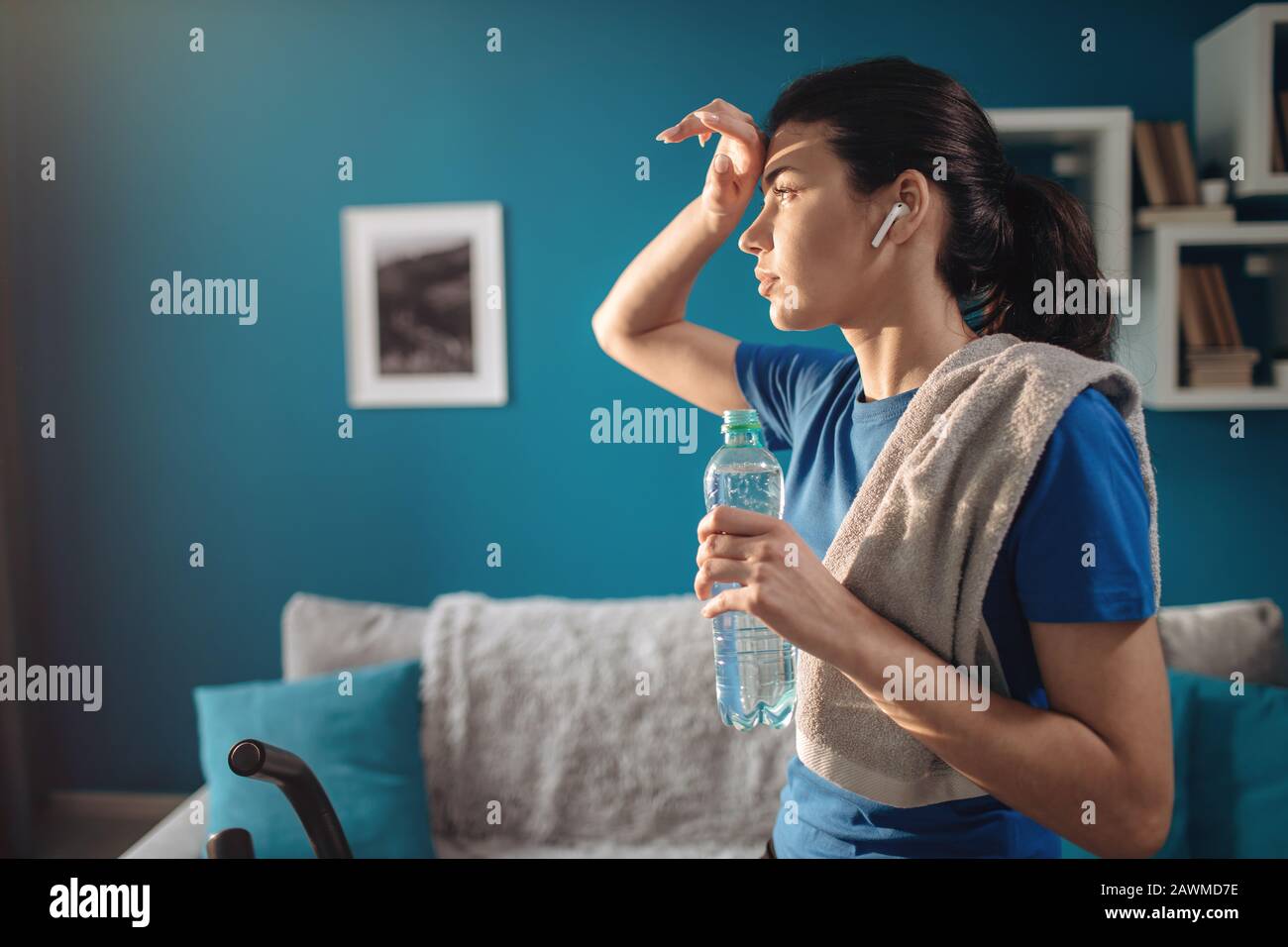Cute Athletic Young Woman Wiping Her Sweaty Forehead Stock Photo