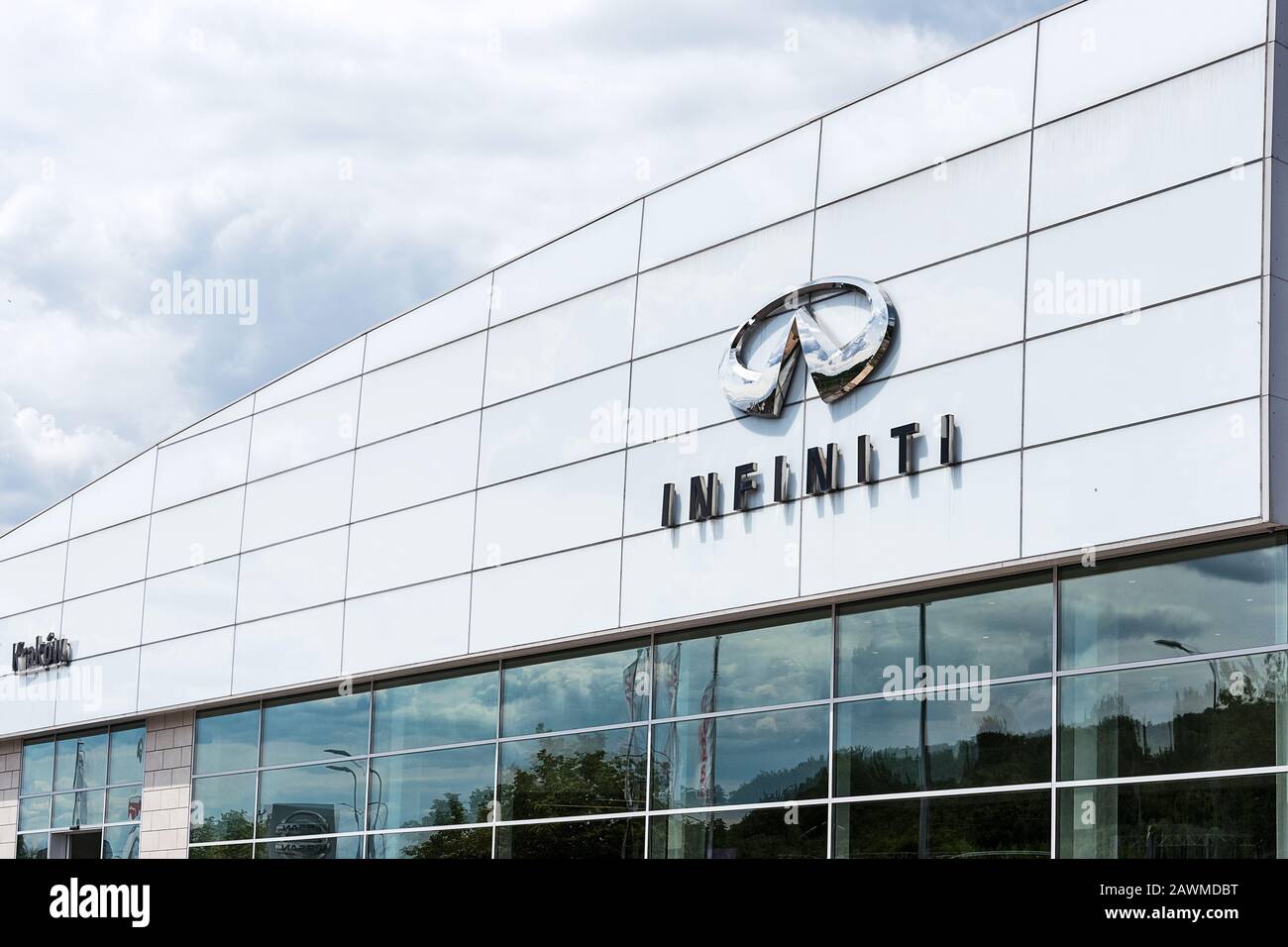 Krakow, Poland, July 12, 2019:  Infiniti logo sign on the car dealership trade salon in Krakow. Infiniti is the luxury vehicle division of Japanese au Stock Photo