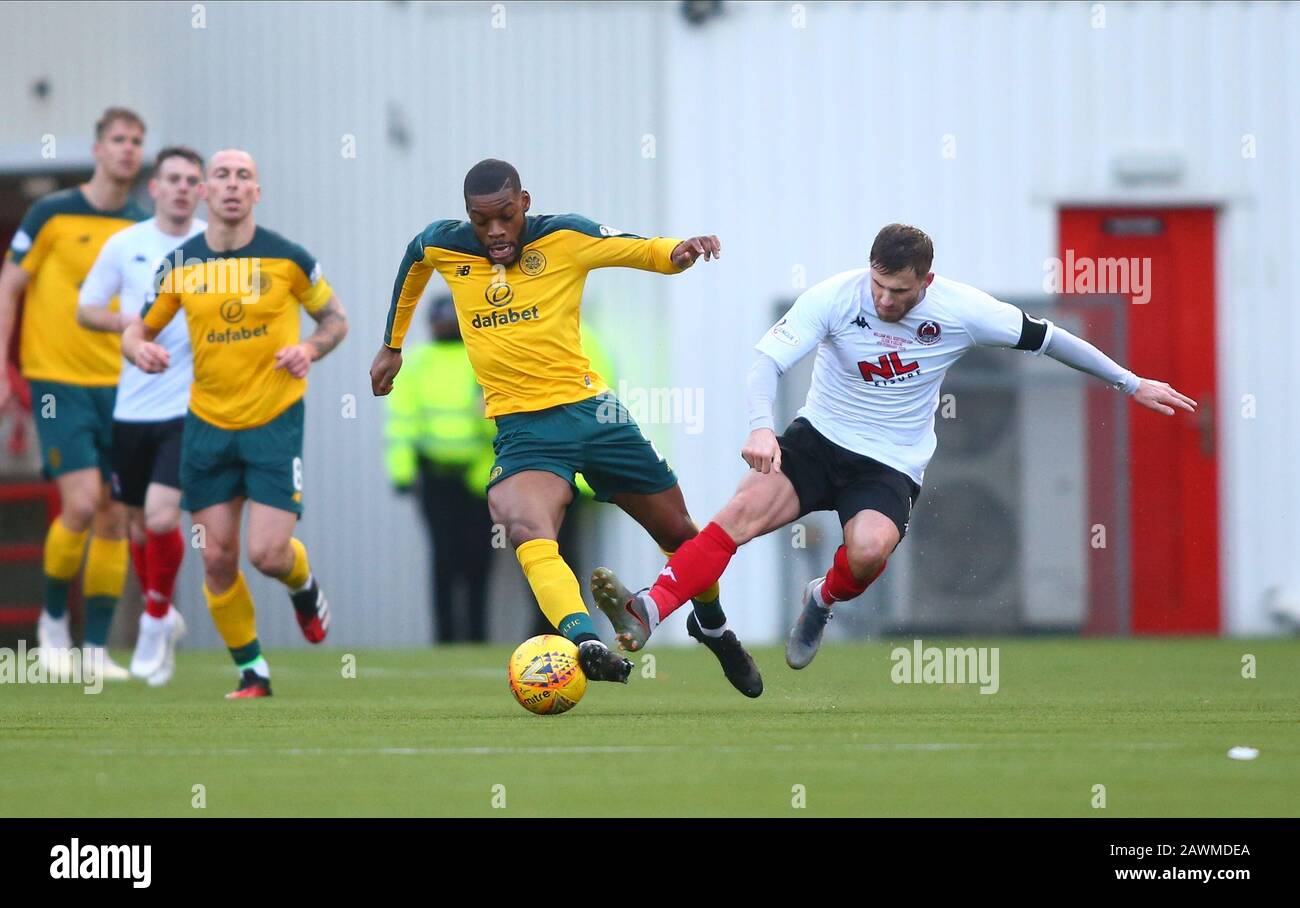 9th February 2020; Broadwood Stadium, Cumbernauld, North Lanarkshire, Scotland; Scottish Cup Football, Clyde versus Celtic; David Goodwillie of Clyde tackles Olivier Ntcham of Celtic Stock Photo