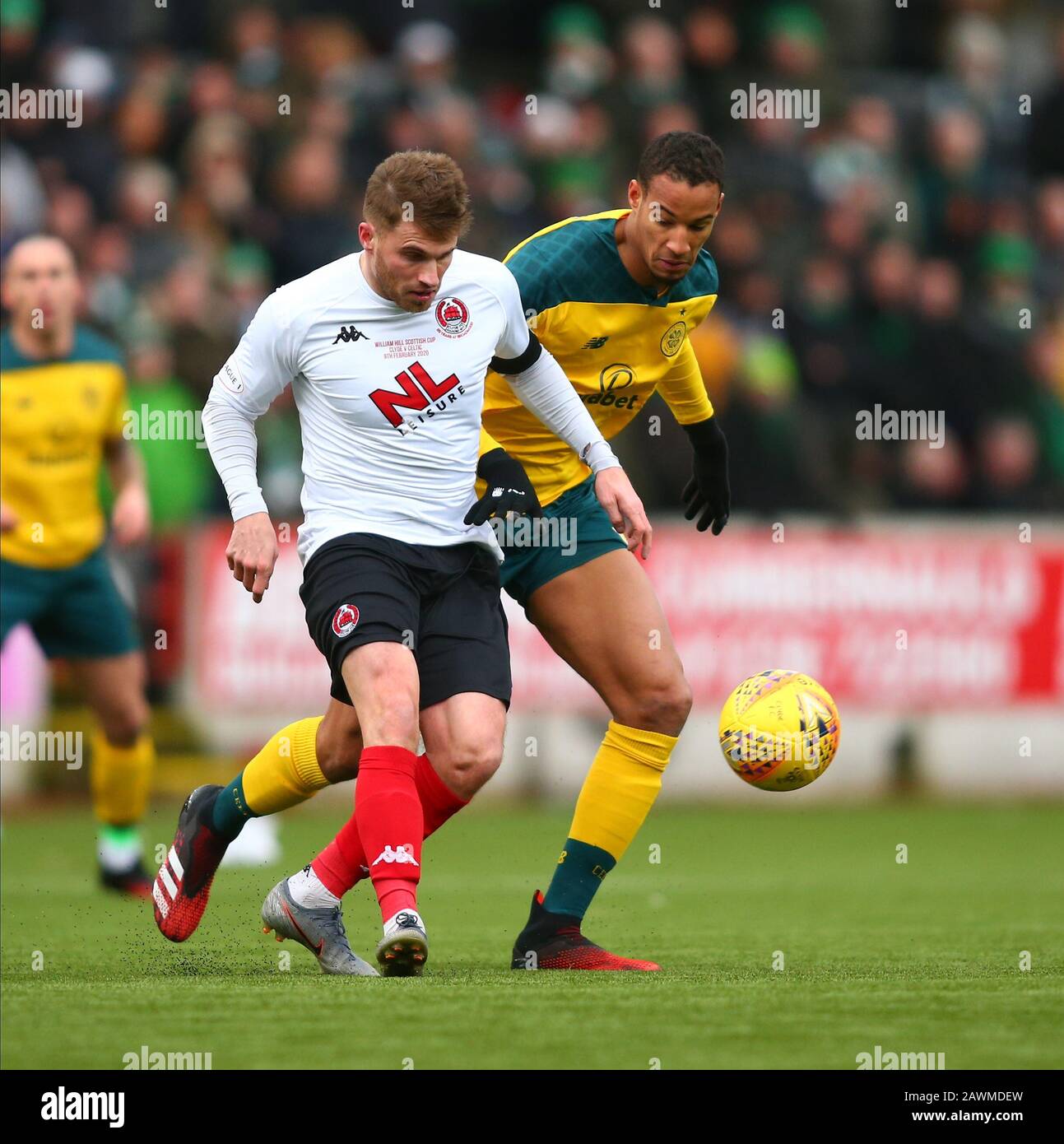 9th February 2020; Broadwood Stadium, Cumbernauld, North Lanarkshire, Scotland; Scottish Cup Football, Clyde versus Celtic; David Goodwillie of Clyde clears from Christopher Jullien of Celtic Stock Photo