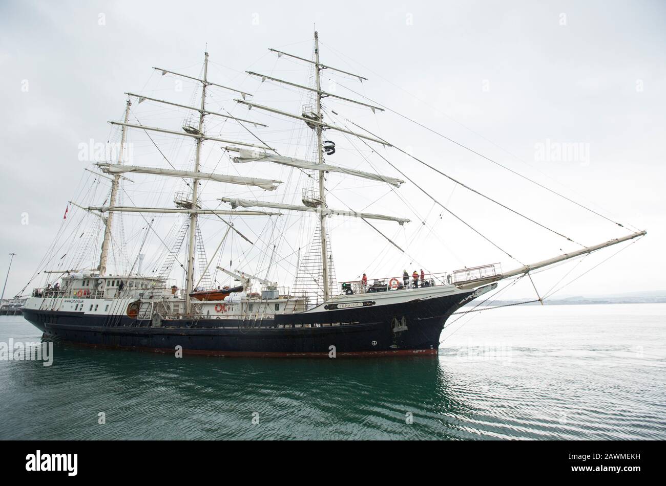 The Tall Ship Tenacious approaching Weymouth harbour in Dorset. The Tenacious was completed in 2000 and is designed for both able-bodied and disabled Stock Photo