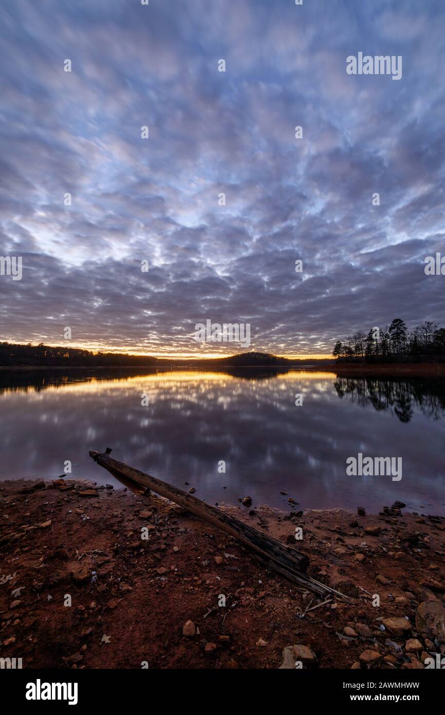 Sunset - Lake Sidney Lanier. A winter sunset reflected on the water's surface at Bolding Mill Campground. Bolding Mill Park is located in Hall County, Stock Photo