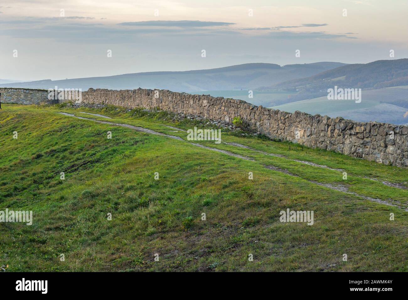 ruins of long wall of medieval stronghod Stock Photo