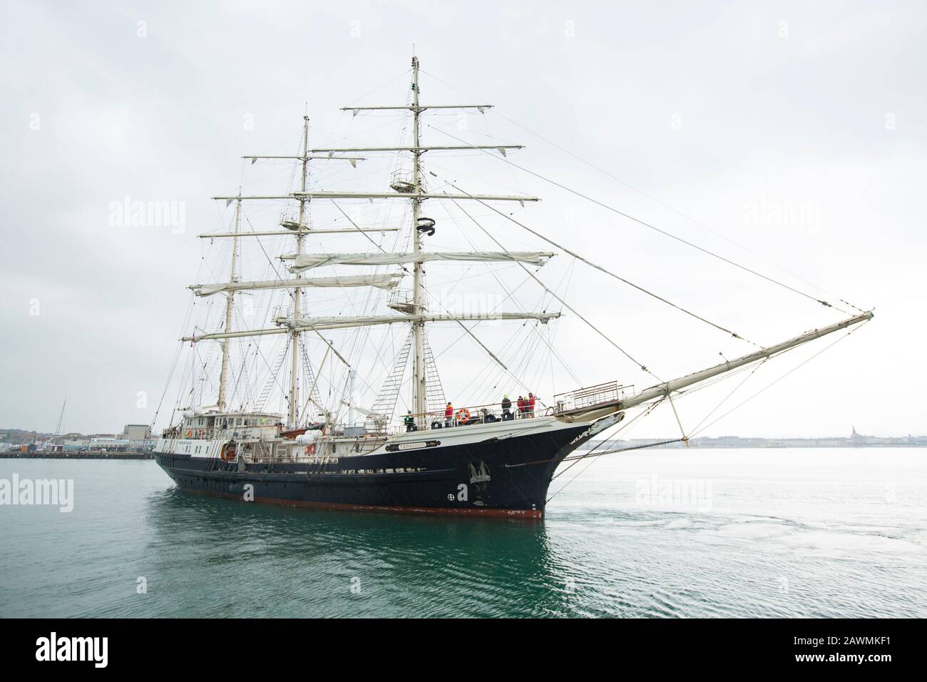 The Tall Ship Tenacious approaching Weymouth harbour in Dorset. The Tenacious was completed in 2000 and is designed for both able-bodied and disabled Stock Photo