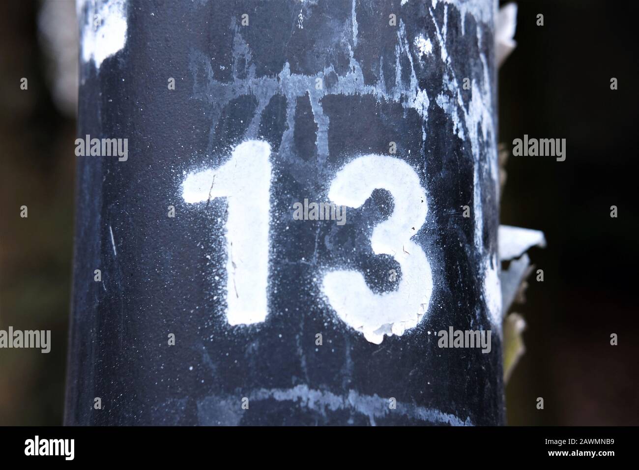 number 13 sprayed with white paint - bad luck superstition concept Stock Photo